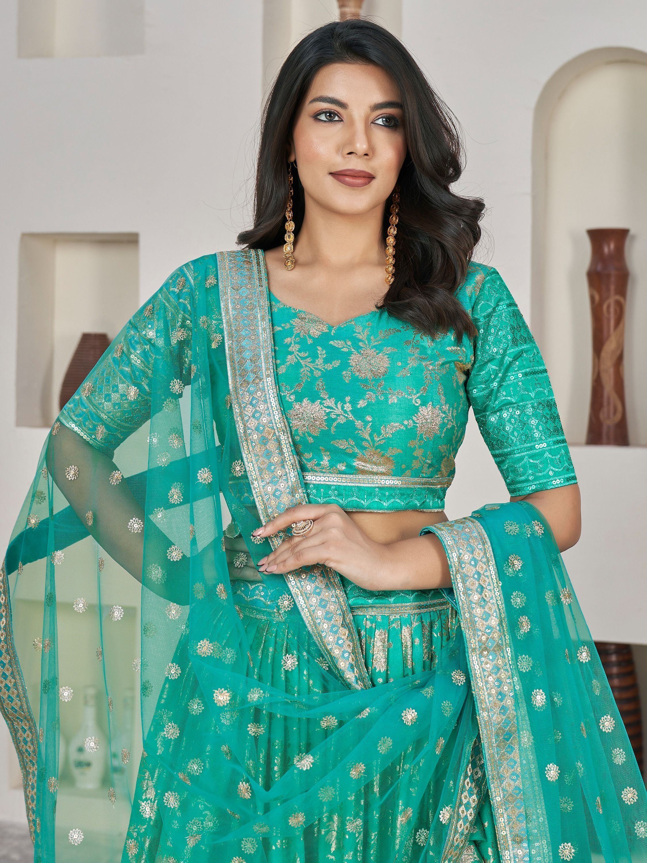 Captivating Sea Green Zari Embroidered Jacquard Lehenga Choli