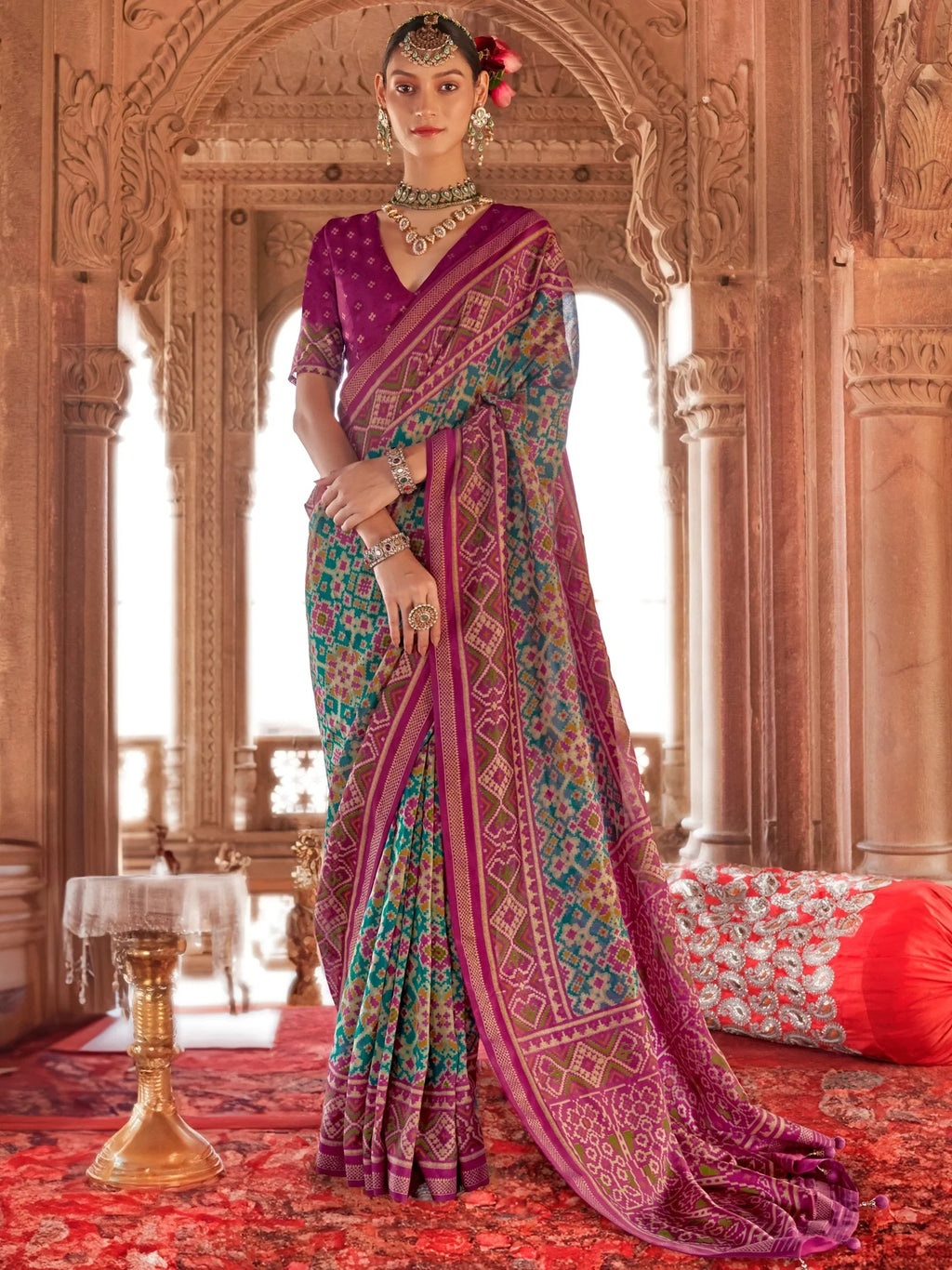 Mesmerizing Teal Blue Patola Printed Georgette Festival Wear Saree