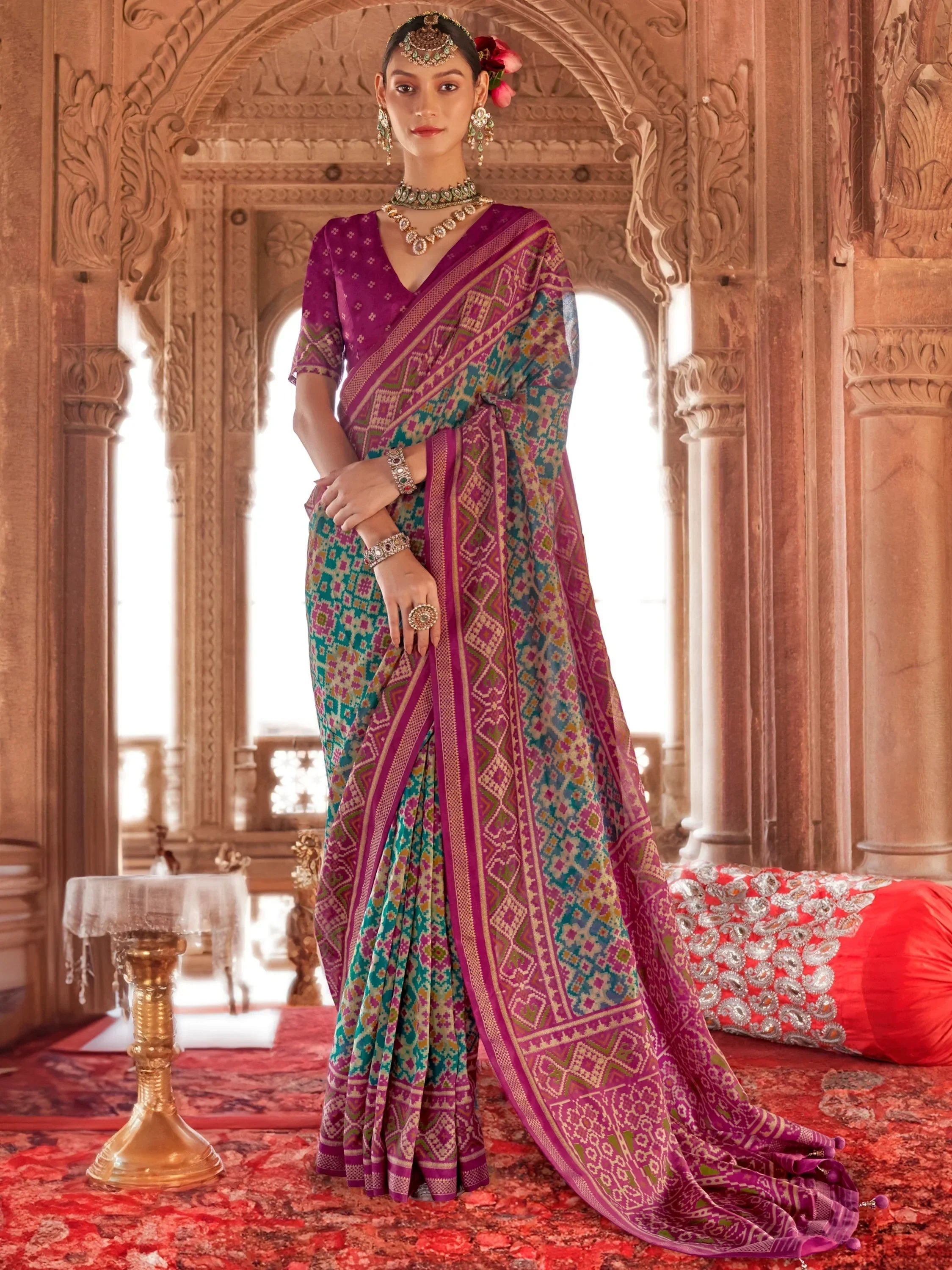 Mesmerizing Teal Blue Patola Printed Georgette Festival Wear Saree