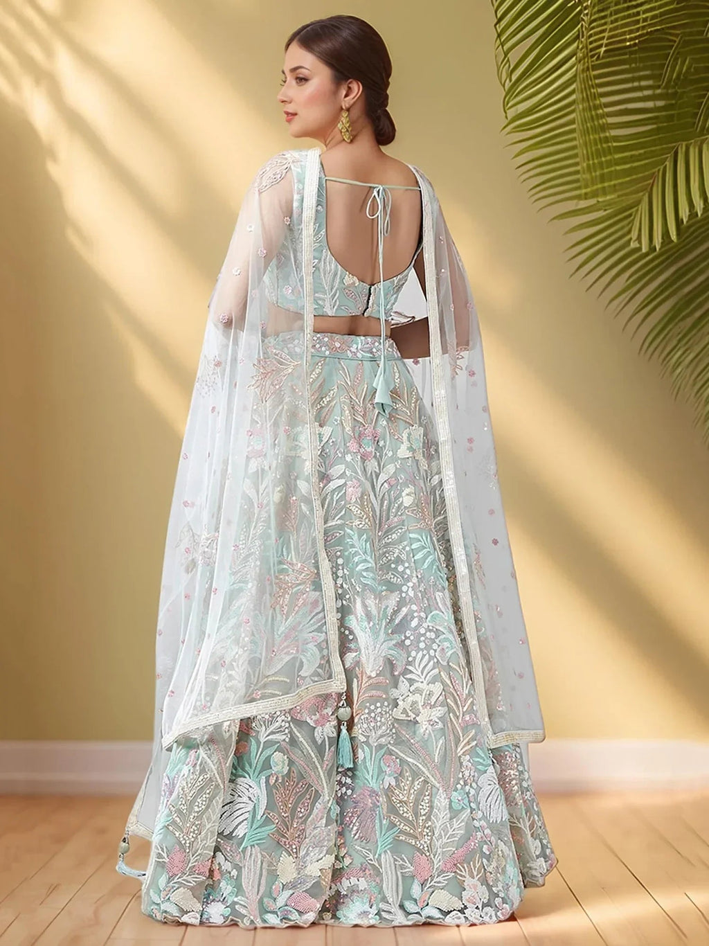 Spectacular Pista Green Sequins Net Wedding Wear Lehenga Choli