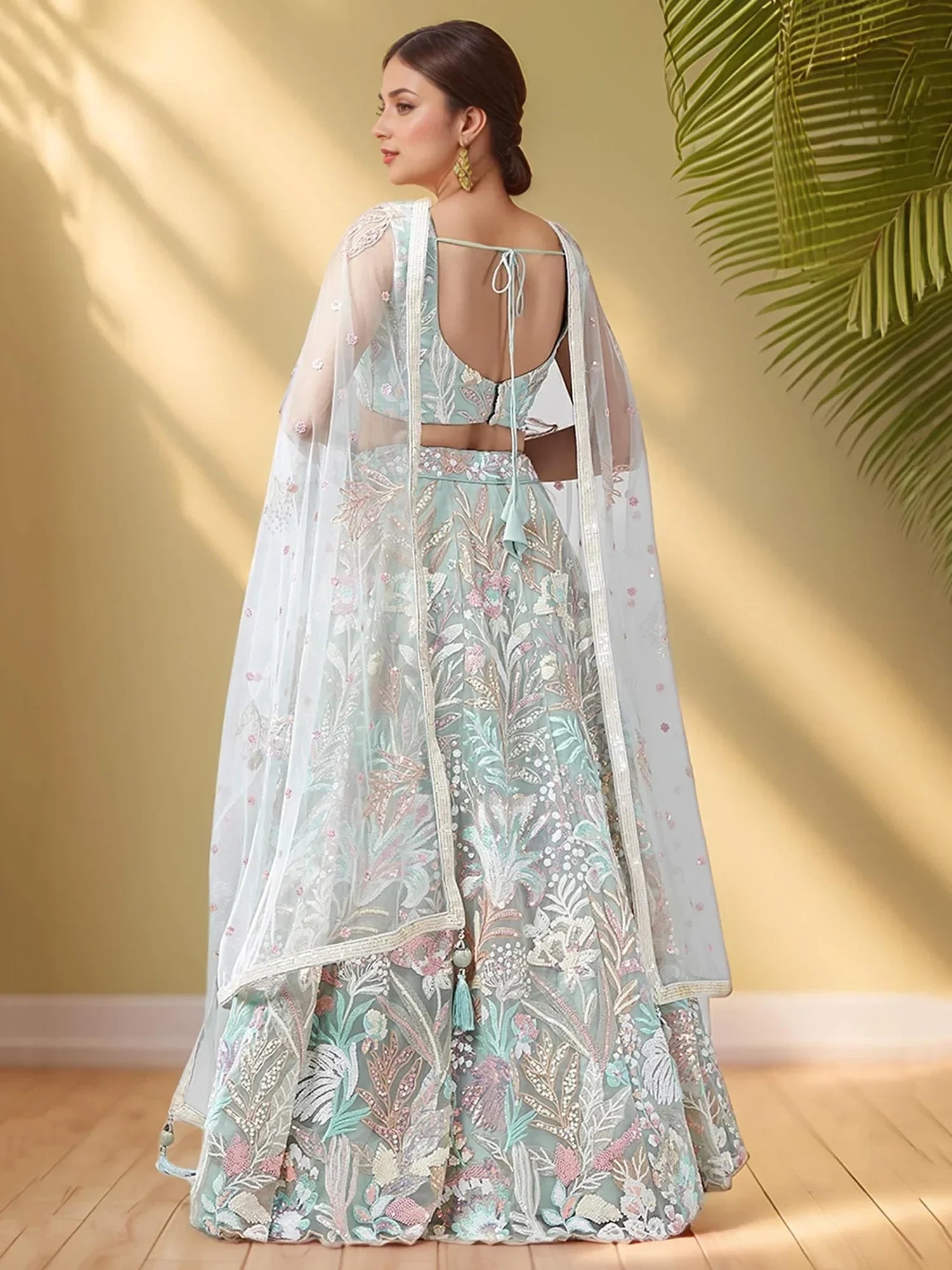 Spectacular Pista Green Sequins Net Wedding Wear Lehenga Choli