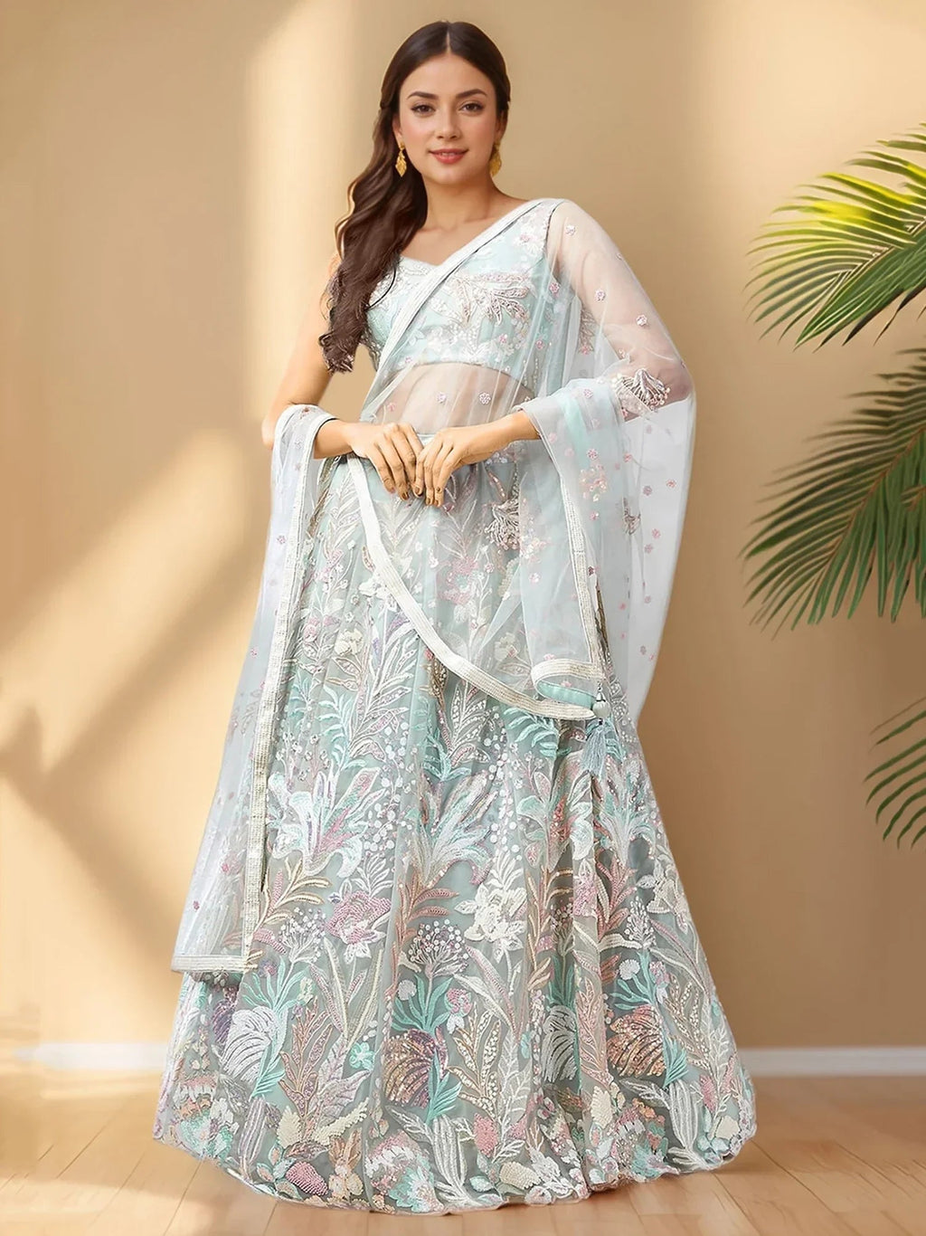Spectacular Pista Green Sequins Net Wedding Wear Lehenga Choli